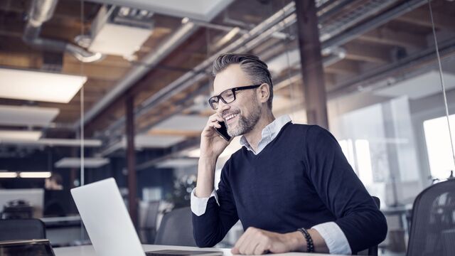 Businessman working in a new office SMALL